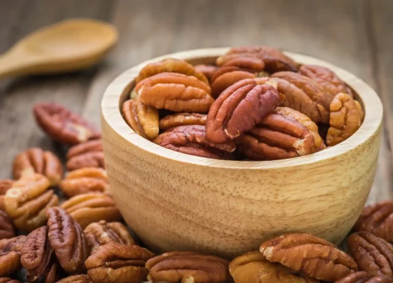 Pecan nuts in wooden bowl