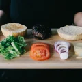Ingredients for a burger showcasing a balanced diet on a cutting board