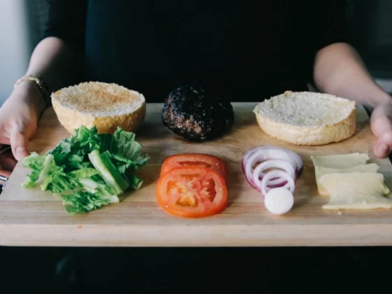 Ingredients for a burger showcasing a balanced diet on a cutting board