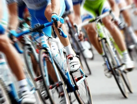 cyclists in a race showing high-intensity interval training