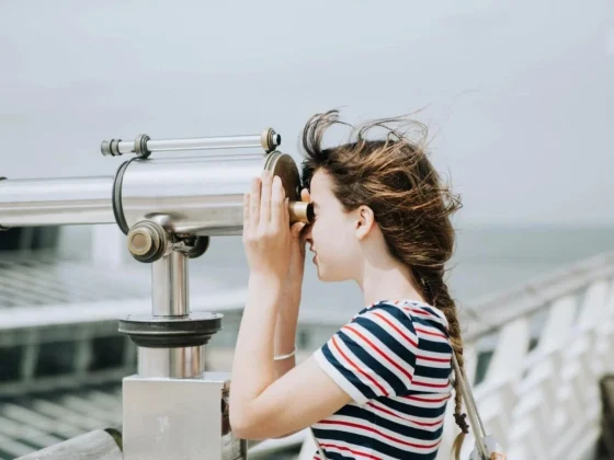 girl using telescope for epidemiological studies
