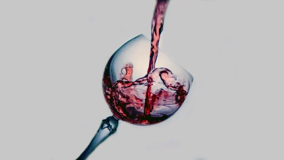 alcohol in white glass pouring