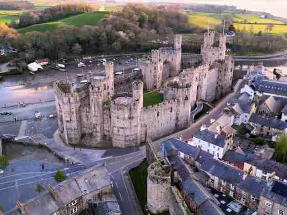 Caernarfon Castle in Gwynedd Wales at dusk