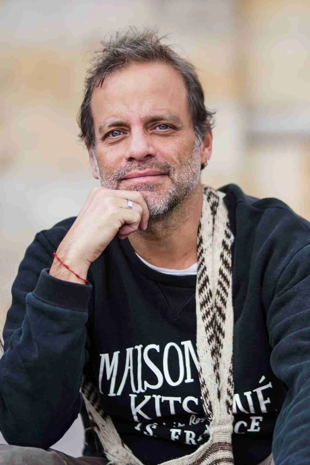 Mature man with graying hair relaxing outdoors